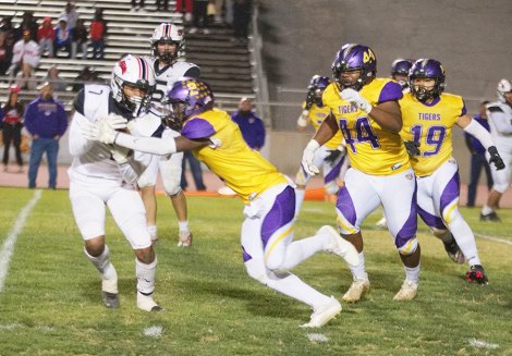 Tigers earn No. 3 seed in Division II football playoffs and get first-round bye. Will play Washington-Dinuba winner Lemoore's Demel Turner sacks the Bullpups quarterback in Friday night's WYL season win over the visiting Hanford Bullpups.